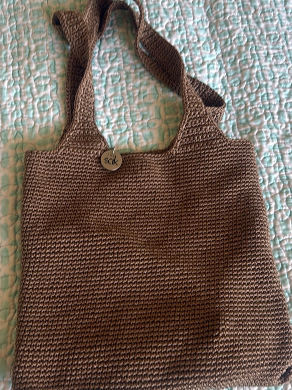 The Sak Brown Crochet Tote with Branded Button